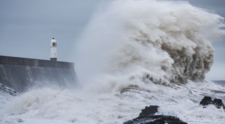 Waves crashing against the UK coast